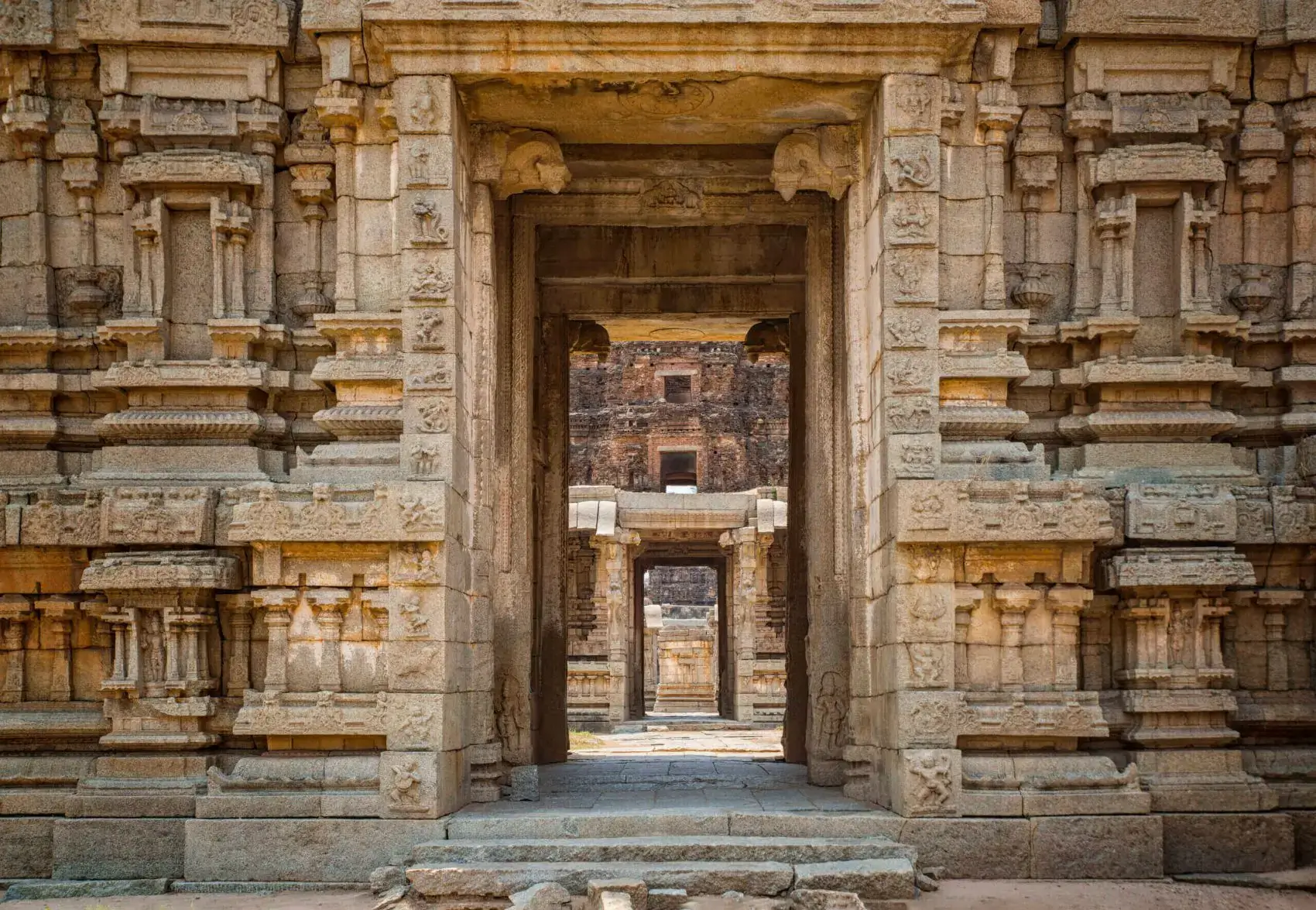 Ancient stone temple doorway with intricate carvings.